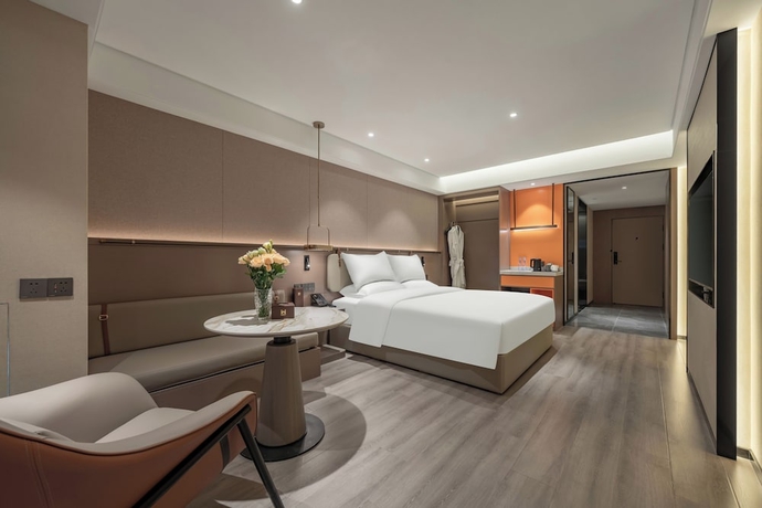 Imagen de la habitación del Hotel World Jinan Wenlvcheng Branch. Foto 9