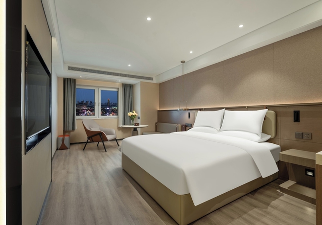 Imagen de la habitación del Hotel World Jinan Wenlvcheng Branch. Foto 10