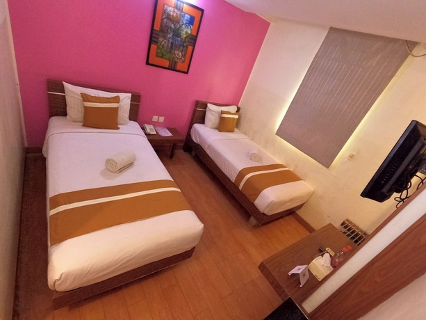 Imagen de la habitación del Hotel World, Pekojan. Foto 9