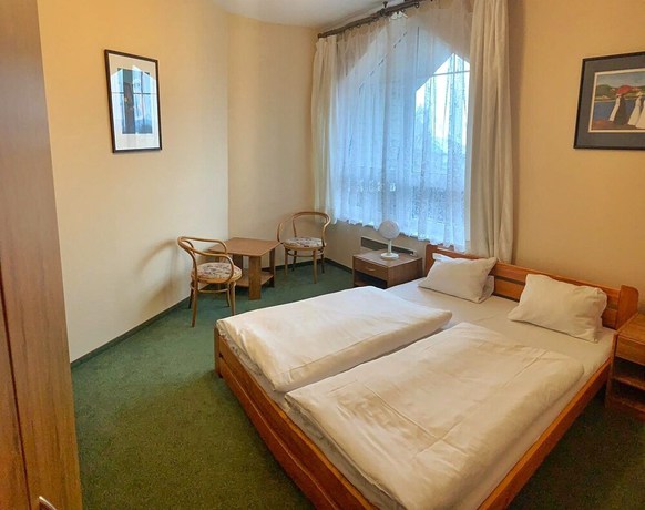 Imagen de la habitación del Hotel World of Harmony. Foto 7