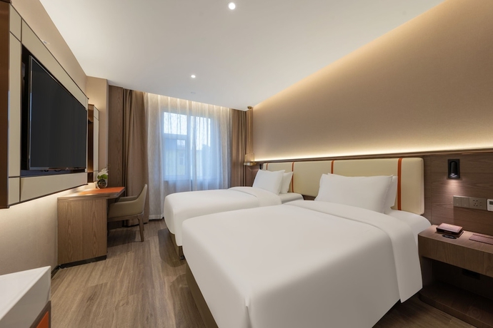 Imagen de la habitación del Hotel WorldQuancheng Sqr Kuanholi Branch. Foto 7