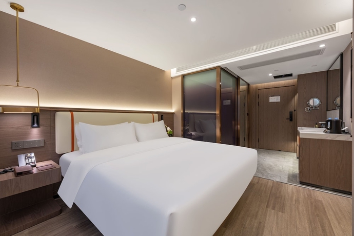 Imagen de la habitación del Hotel WorldQuancheng Sqr Kuanholi Branch. Foto 9