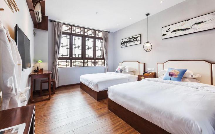 Imagen de la habitación del Hotel Wu Xi. Foto 7