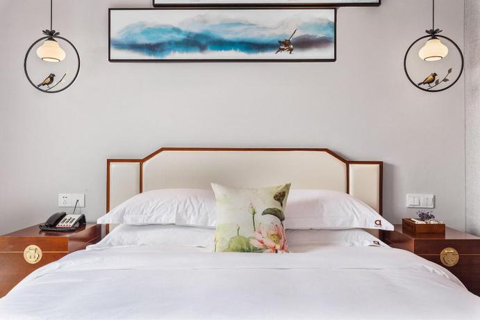 Imagen de la habitación del Hotel Wu Xi. Foto 10