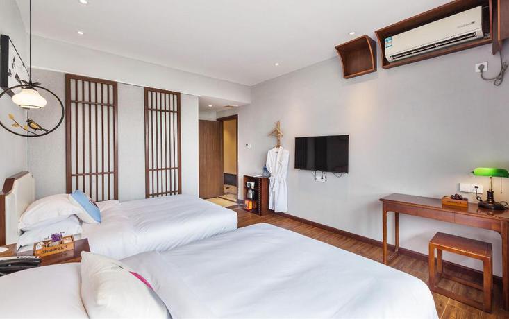 Imagen de la habitación del Hotel Wu Xi. Foto 12