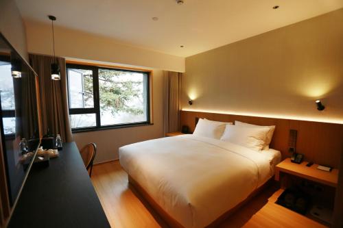 Imagen de la habitación del Hotel Wudang Mountain The Yew House. Foto 14