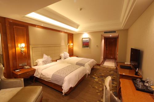 Imagen de la habitación del Hotel Wuhai Xiyue International. Foto 3