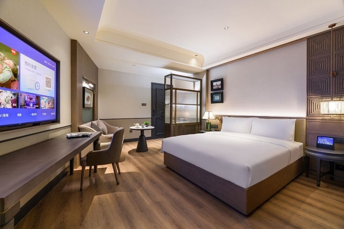 Imagen de la habitación del Hotel Wuhan Hankou Jiangtan Manxin Mansion. Foto 5