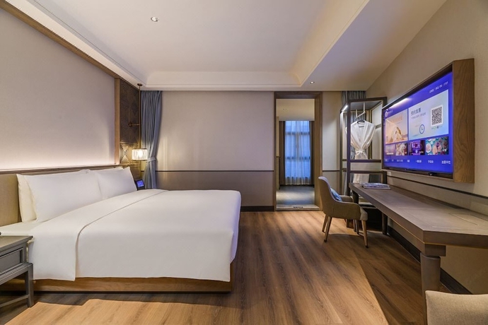 Imagen de la habitación del Hotel Wuhan Hankou Jiangtan Manxin Mansion. Foto 9