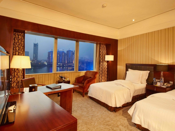 Imagen de la habitación del Hotel Wuhan Jin Jiang International. Foto 9