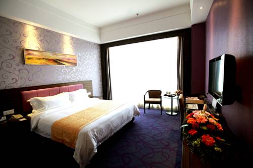 Imagen de la habitación del Hotel Wuhan New Beacon Jinyinhu International. Foto 5