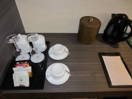 Imagen de la habitación del Hotel Wuhan New Beacon Jinyinhu International. Foto 11