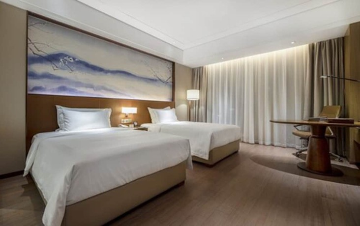Imagen de la habitación del Hotel Wuhan Optics Valley Convention. Foto 10