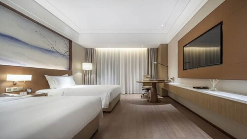 Imagen de la habitación del Hotel Wuhan Optics Valley Convention. Foto 12