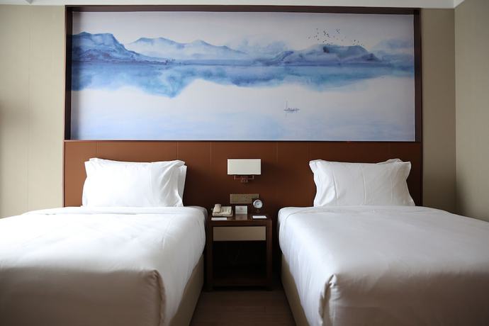 Imagen de la habitación del Hotel Wuhan Optics Valley Convention. Foto 15