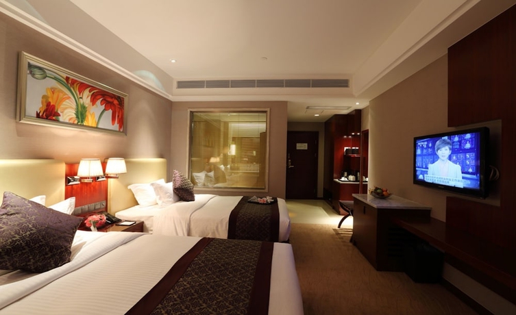 Imagen de la habitación del Hotel Wuhan Tianchimel. Foto 9
