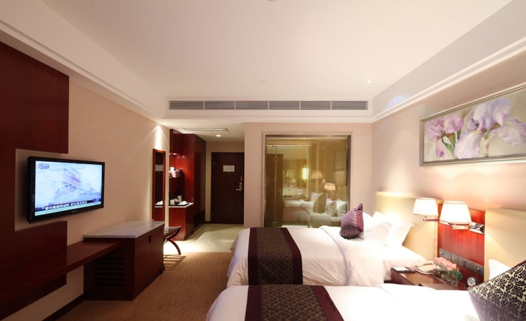 Imagen de la habitación del Hotel Wuhan Tianchimel. Foto 11