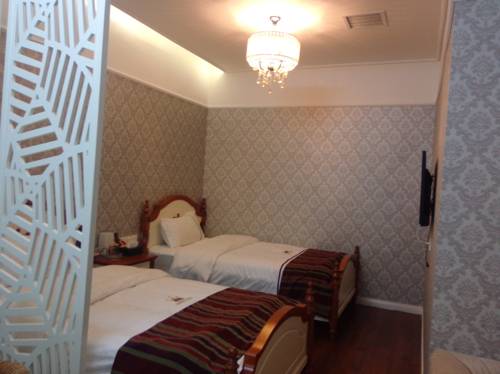 Imagen de la habitación del Hotel Wuhan Xixi Holiday. Foto 1