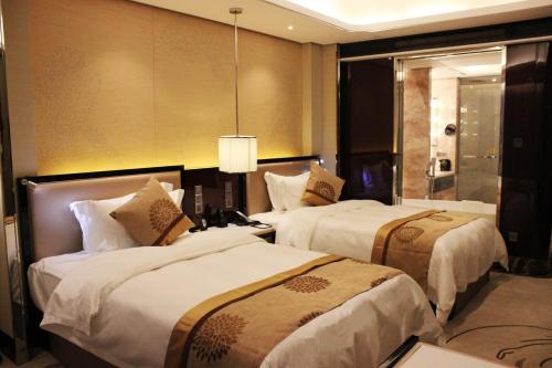 Imagen de la habitación del Hotel Wuhan You Yi International. Foto 2
