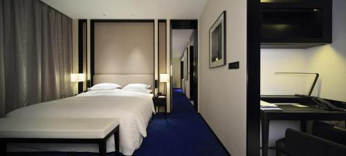 Imagen de la habitación del Hotel Wuhan Ziyuan. Foto 17