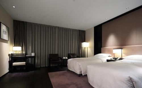 Imagen de la habitación del Hotel Wuhan Ziyuan. Foto 18