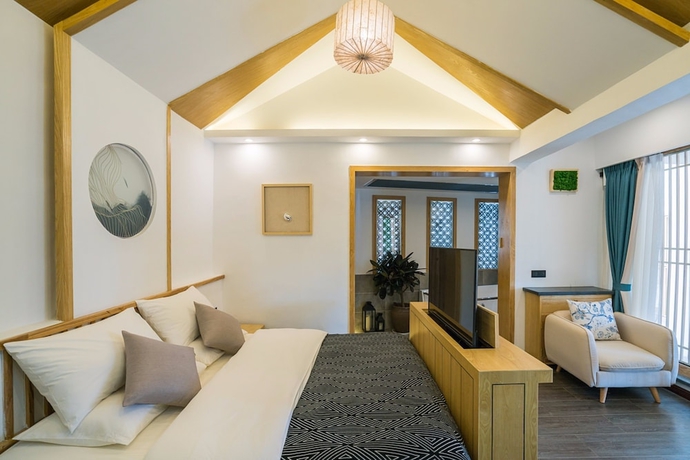 Imagen de la habitación del Hotel Wuhua Yishu Lijiang Flagship. Foto 2
