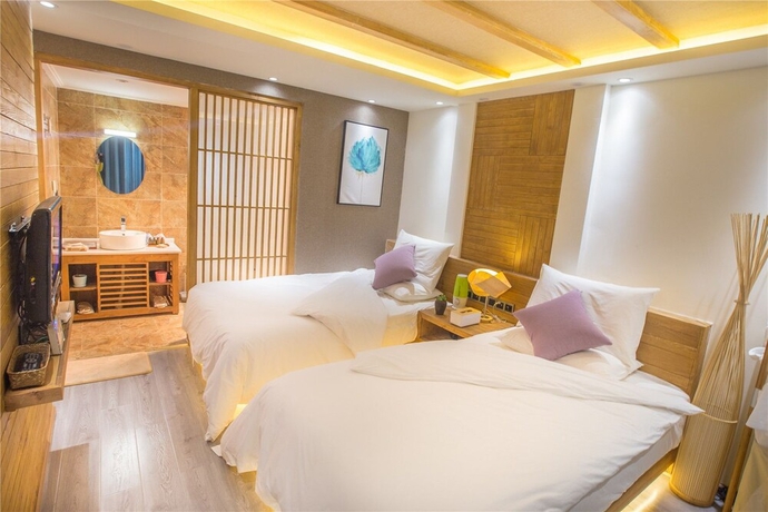 Imagen de la habitación del Hotel Wuhua Yishu Lijiang Flagship. Foto 4