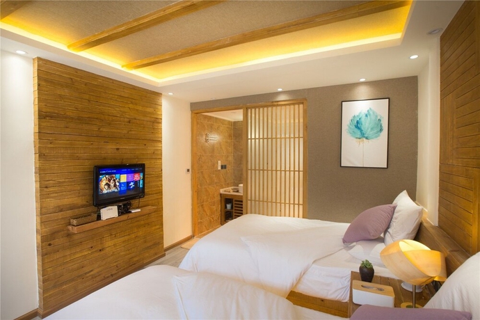 Imagen de la habitación del Hotel Wuhua Yishu Lijiang Flagship. Foto 5
