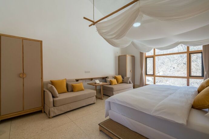 Imagen de la habitación del Hotel Wuhua Yishu Shouzhuo Park. Foto 18