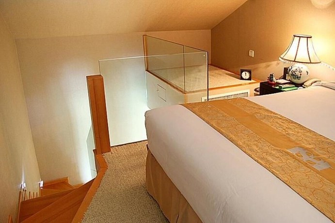 Imagen de la habitación del Hotel Wuxi 1881 Peninsula Hotel. Foto 6