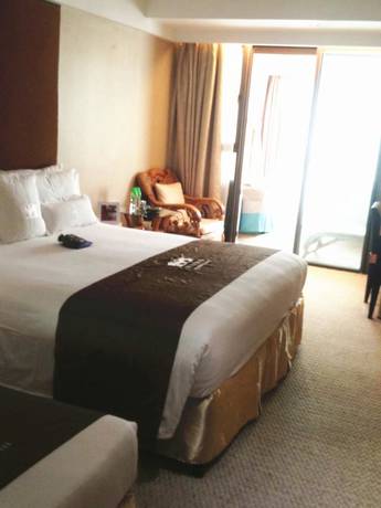 Imagen de la habitación del Hotel Wuxi 1881 Peninsula Hotel. Foto 14