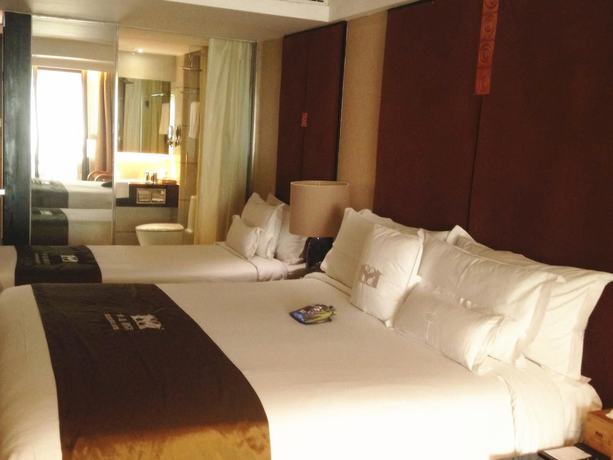 Imagen de la habitación del Hotel Wuxi 1881 Peninsula Hotel. Foto 15