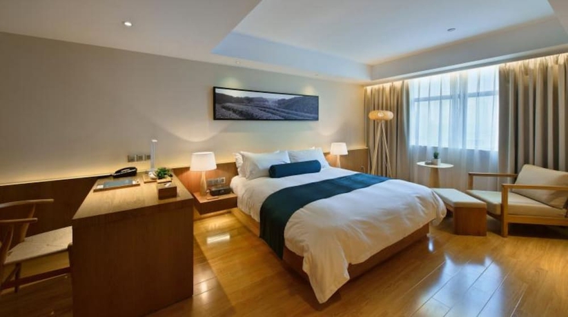 Imagen de la habitación del Hotel Wuxi Shuyu. Foto 11