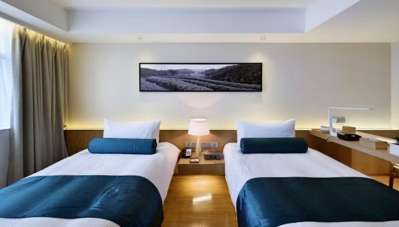 Imagen de la habitación del Hotel Wuxi Shuyu. Foto 12