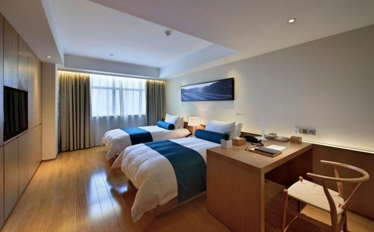 Imagen de la habitación del Hotel Wuxi Shuyu. Foto 14