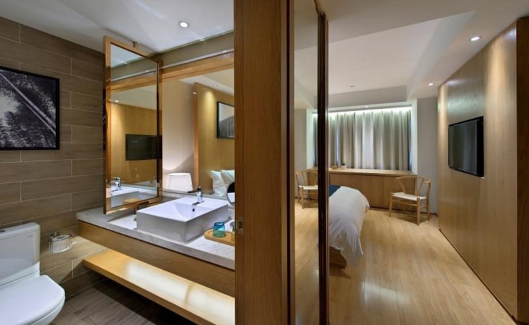 Imagen de la habitación del Hotel Wuxi Shuyu. Foto 17