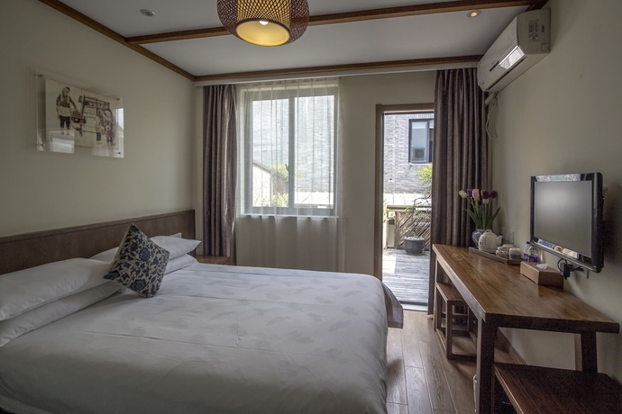 Imagen de la habitación del Hotel Wuyang Inn Hangzhou. Foto 7