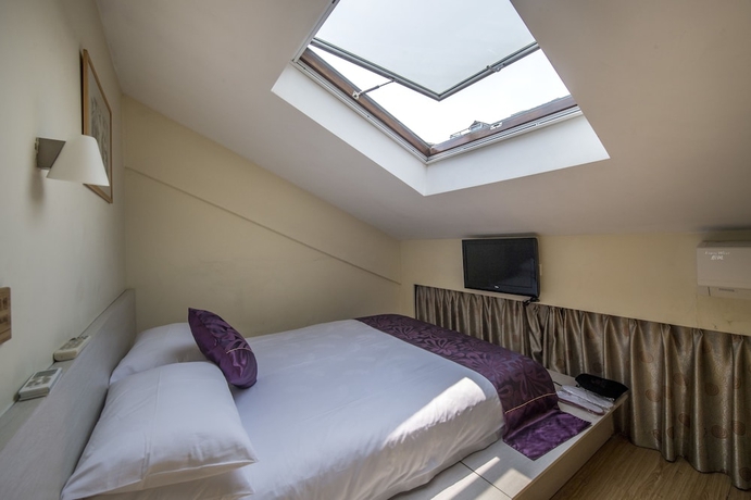 Imagen de la habitación del Hotel Wuyang Inn Hangzhou. Foto 8