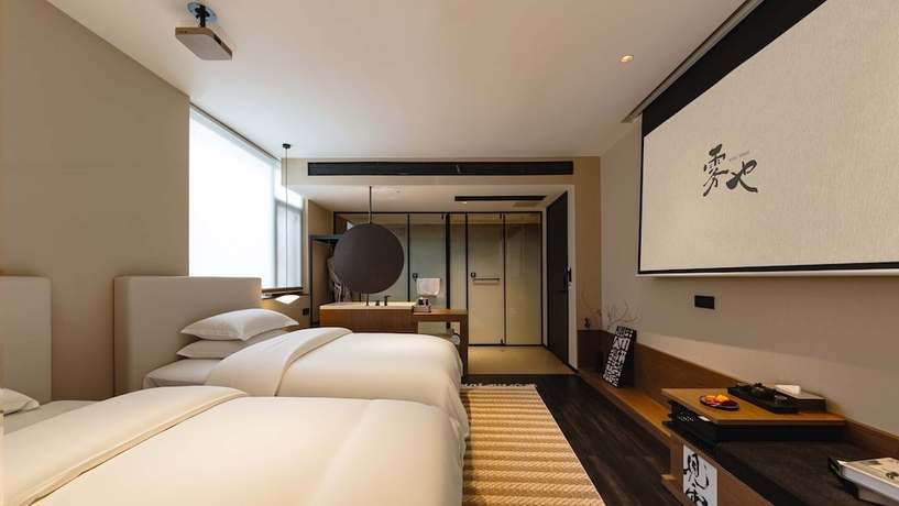 Imagen de la habitación del Hotel Wuye WOO YEAH Tangchi. Foto 2