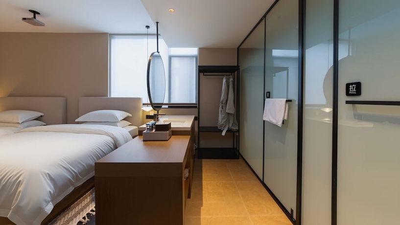 Imagen de la habitación del Hotel Wuye WOO YEAH Tangchi. Foto 3