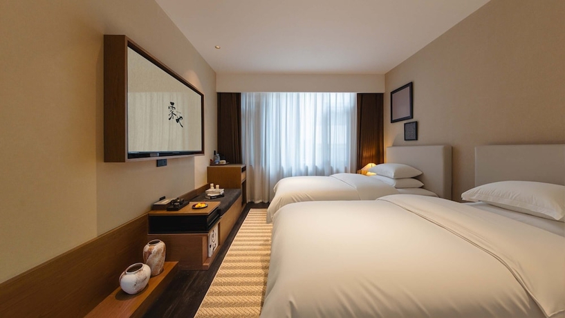 Imagen de la habitación del Hotel Wuye WOO YEAH Tangchi. Foto 8