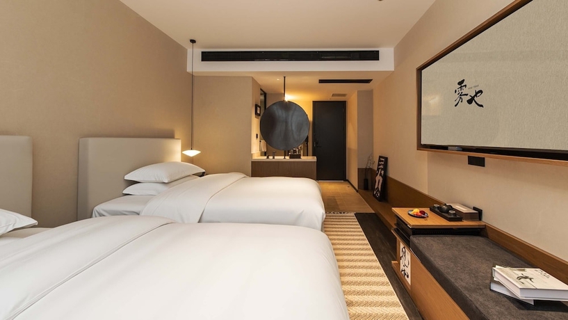 Imagen de la habitación del Hotel Wuye WOO YEAH Tangchi. Foto 9