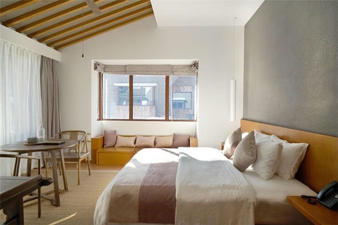 Imagen de la habitación del Hotel Wuyishan Demaotang Resort. Foto 2