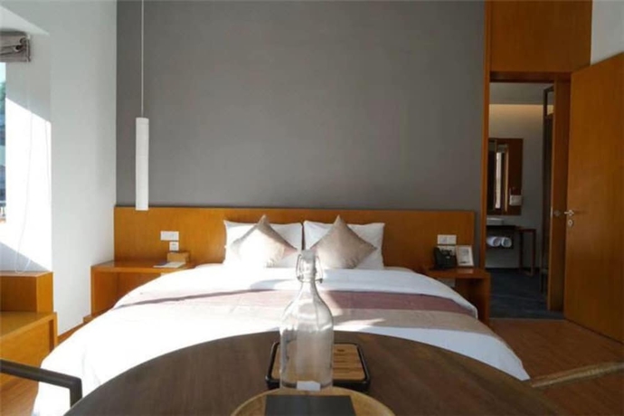 Imagen de la habitación del Hotel Wuyishan Demaotang Resort. Foto 6