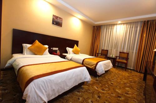 Imagen de la habitación del Hotel Wuyuan Huadu. Foto 10