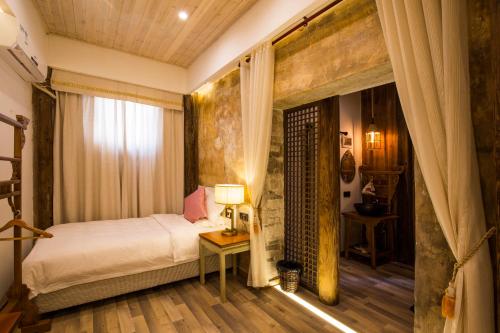 Imagen de la habitación del Hotel Wuyuan Huamantang Liuli Xiangyuan. Foto 6