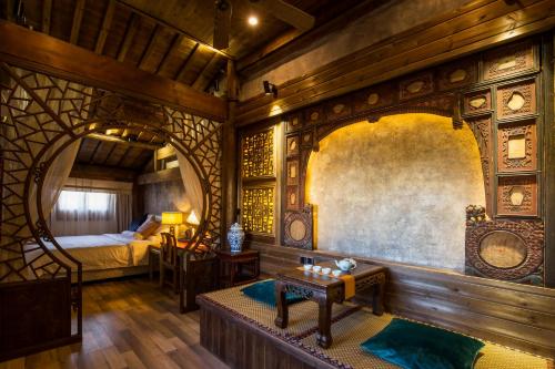 Imagen de la habitación del Hotel Wuyuan Huamantang Liuli Xiangyuan. Foto 7