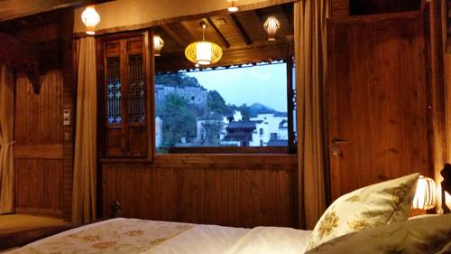 Imagen de la habitación del Hotel Wuyuan Huangling Villa. Foto 2