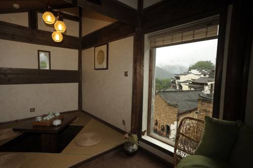 Imagen de la habitación del Hotel Wuyuan Huangling Villa. Foto 3