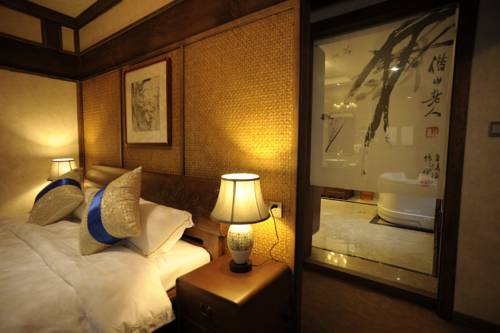 Imagen de la habitación del Hotel Wuyuan Huangling Villa. Foto 4